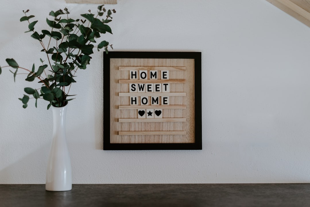 HOME SWEET HOME letter board with eucalyptus in a vase.